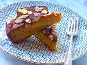 Two slices of Paleo mandarine and almond cake that is gluten, grain and dairy free.