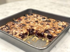 A tray of cherry and almond cake that is a gut healthy recipe.