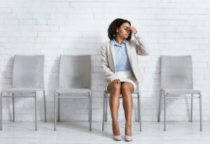 African American woman in business outfit having headache at office hall, copy space. Millennial black lady 