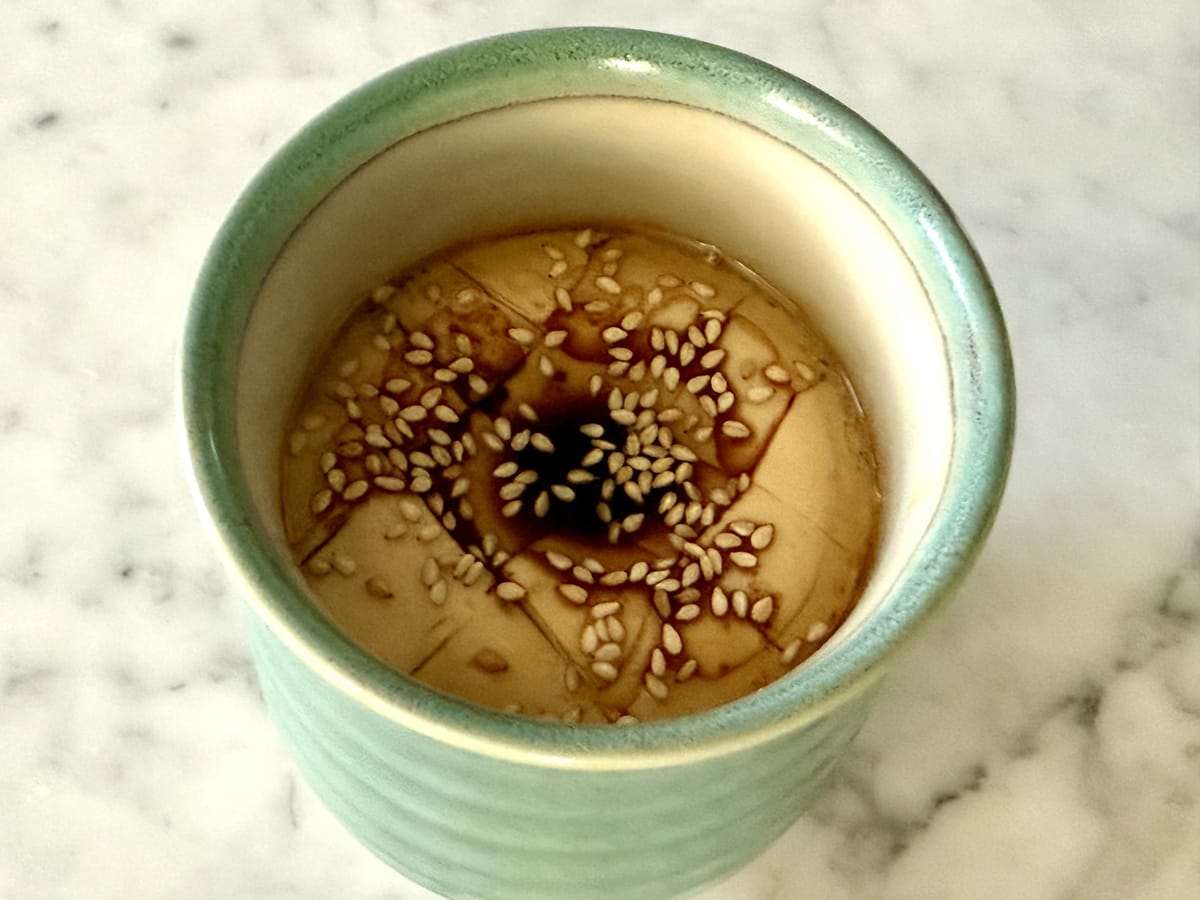 Japanese Savory Eggs served with a drizzle of tamari and a sprinkle of sesame seeds