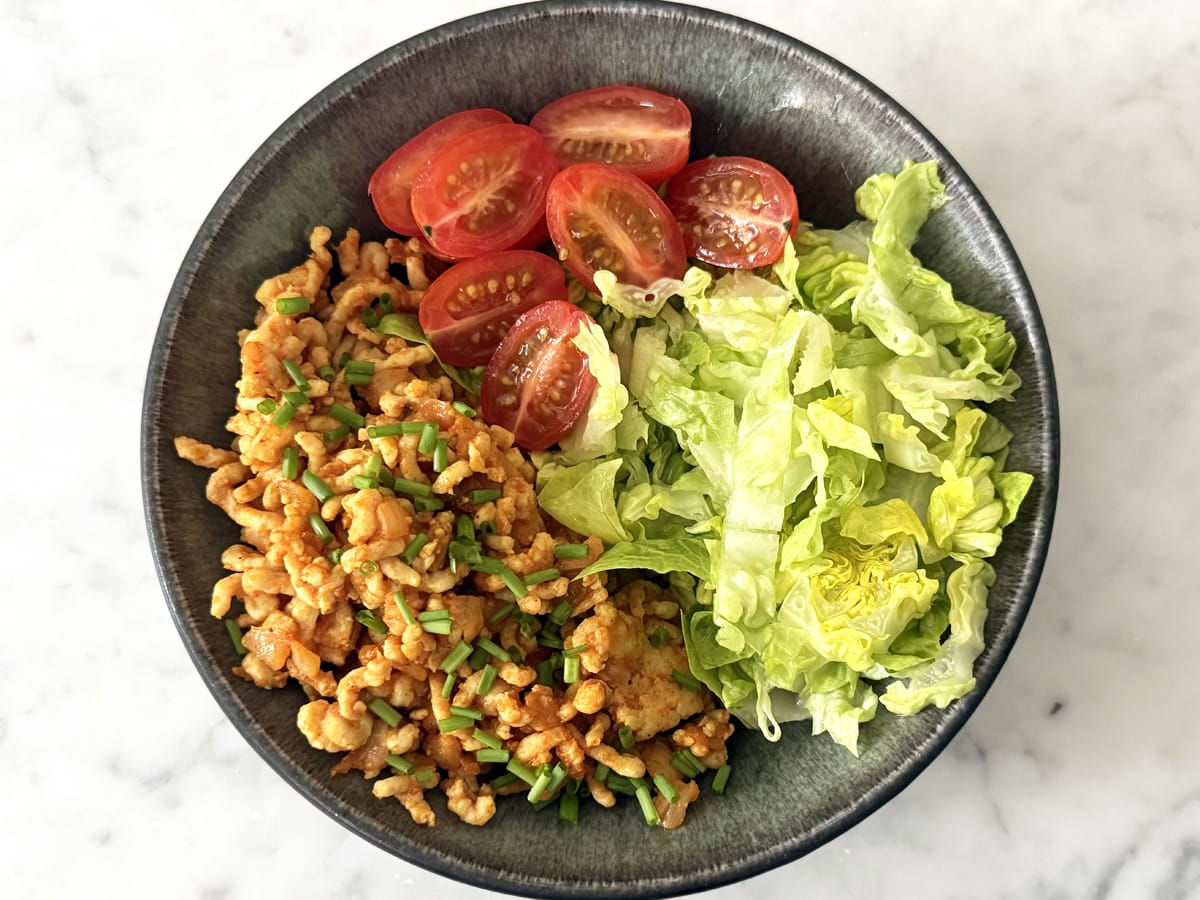 ground chicken bowl with lettuce and tomatoes