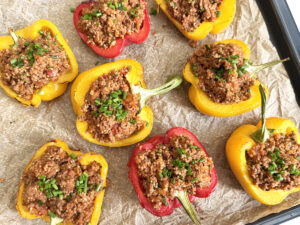 quinoa and beef stuffed peppers garnished with scallions